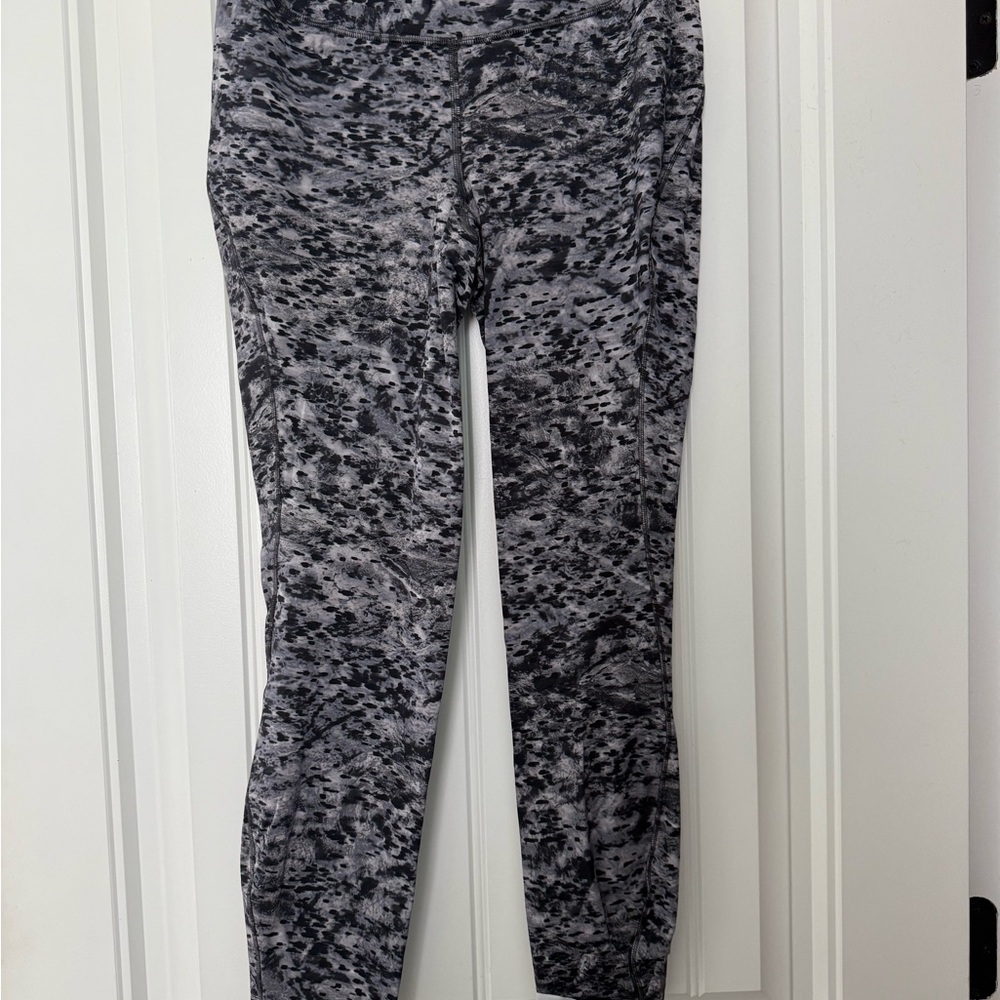 Lululemon Base Pace leggings in grey, black and white print.